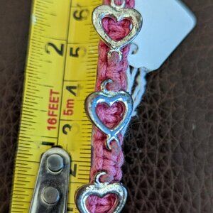Pretty Aeropostale Knotted Pink Bracelet with Gold tone Hearts.